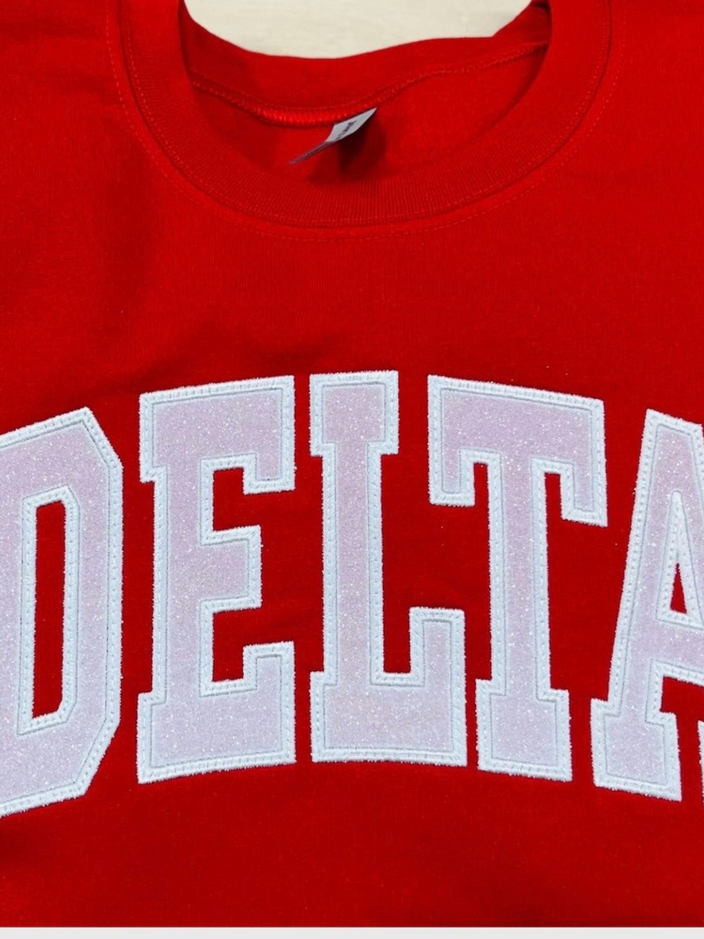 Red Sweatshirt with White Glitter 'DELTA' Applique